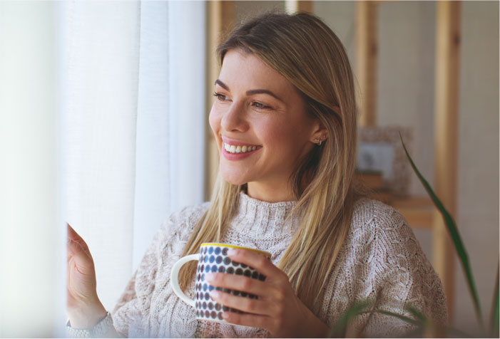 A homeowner enjoying a tranquil home free of noise pollution thanks to Sonic Windows